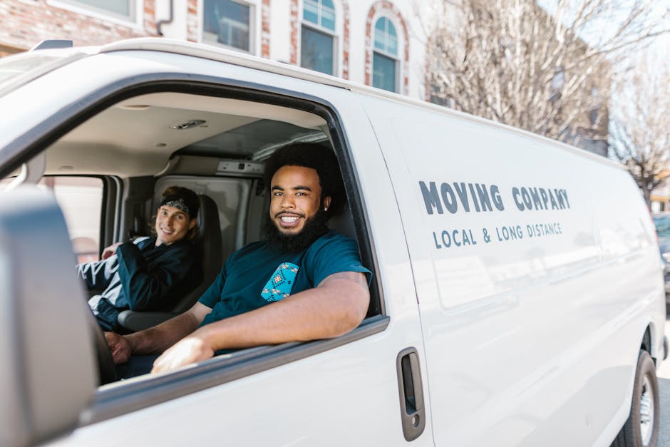Friendly professional movers team assisting a client