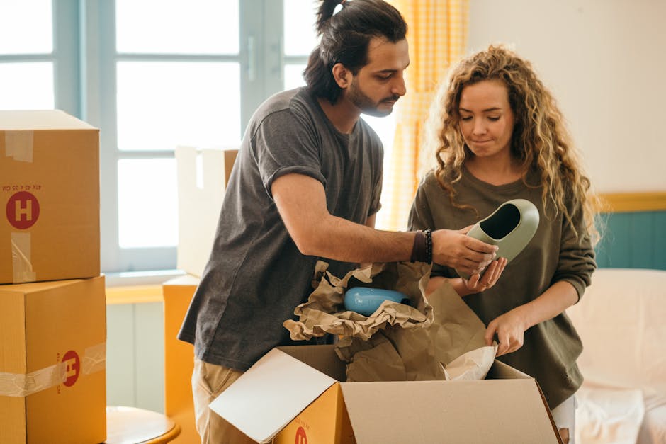 Family unpacking boxes in their new home